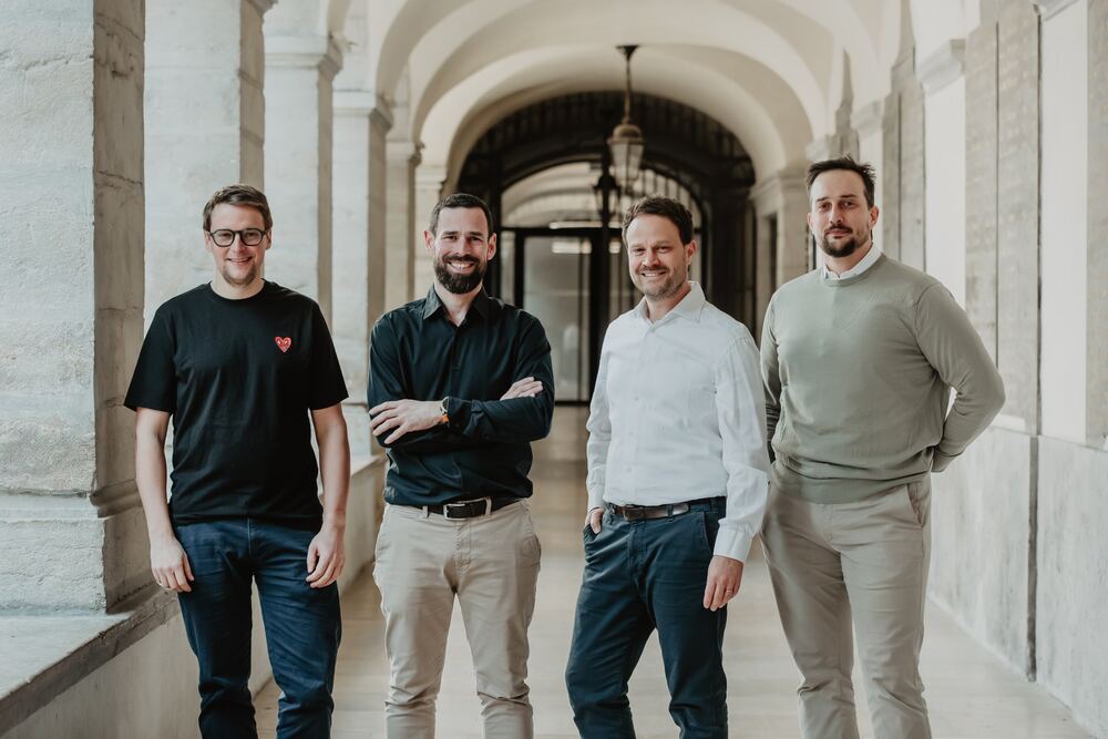 The four Ardipro partners in a stone arcade in Lyon